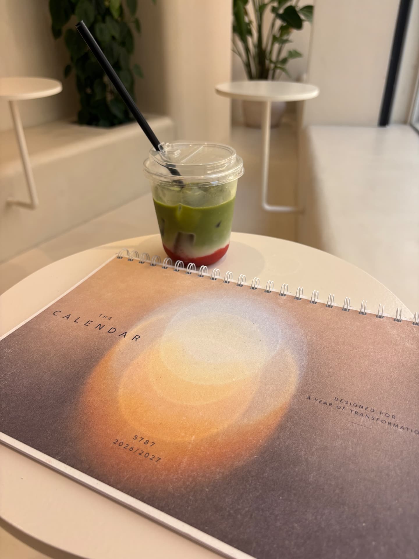 The Calendar in everyday use beside a matcha drink